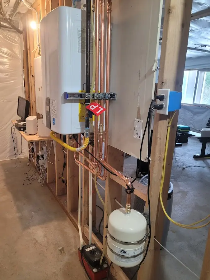 Licensed plumber repairing a kitchen sink in Fairfield